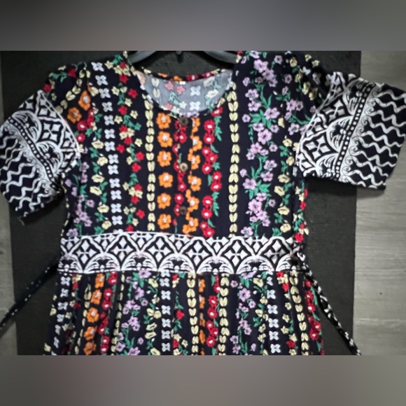 Floral patterns with wavy lines belt will make the edgy feminine appearance. NWT - Picture 3 of 5